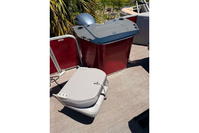 Slide: The Image of 2024 Bennington SV 20 boat interior with red paneling and seating. - 3
