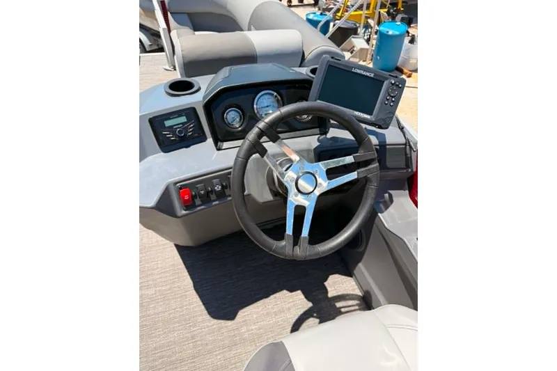 Slide: The Image of 2024 Bennington SV 20 boat dashboard with steering wheel and navigation system. - 4