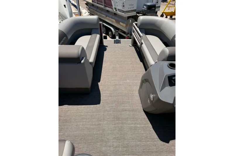 Slide: The Image of 2024 Bennington SV 20 pontoon boat interior with gray seating and console. - 1