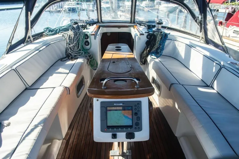 Slide: The Image of Cockpit of 2007 Beneteau Oceanis Clipper 523 with navigation equipment and seating. - 2