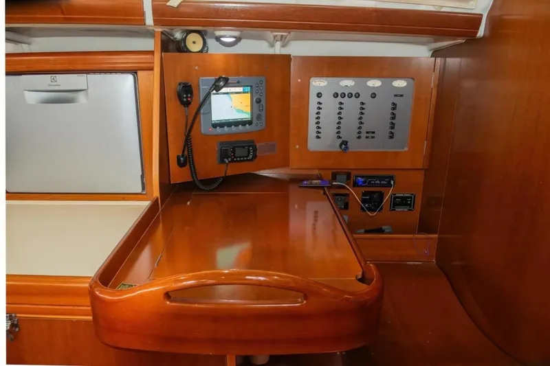 Slide: The Image of Navigation station of 2007 Beneteau Oceanis Clipper 523 yacht with control panel and equipment. - 24