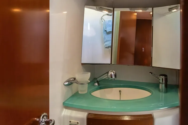 Slide: The Image of Bathroom vanity in 2007 Beneteau Oceanis Clipper 523 yacht with turquoise countertop. - 26