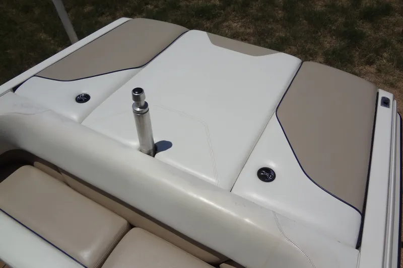 Slide: The Image of 2000 Malibu Sunsetter VLX boat interior with beige and white upholstery. - 14