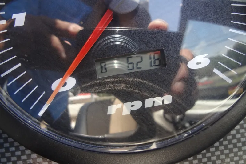 Slide: The Image of Close-up of a 2000 Malibu Sunsetter VLX tachometer showing 5216 RPM. - 23