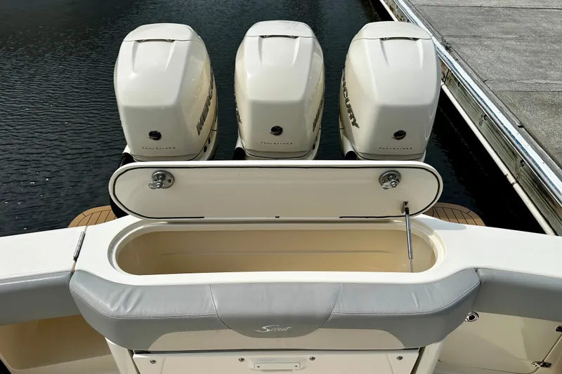 Slide: The Image of 2019 Scout 355 LXF boat with triple Mercury outboard engines at dock. - 16