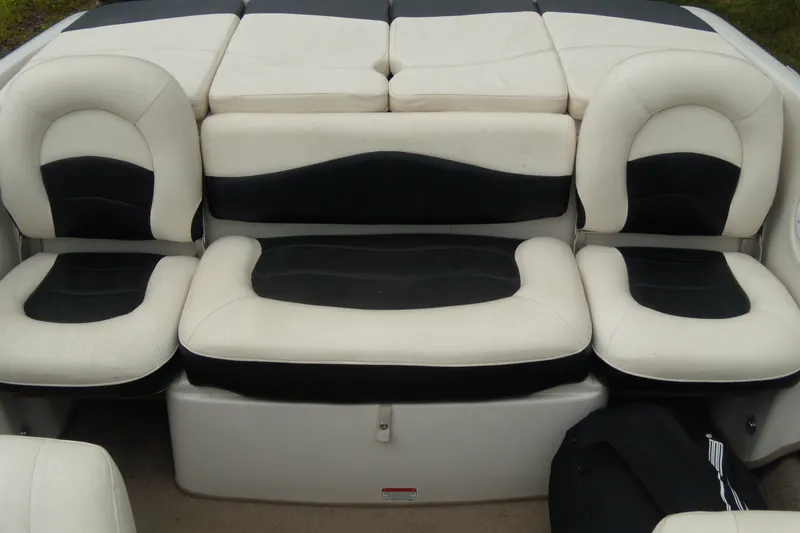 Slide: The Image of 2008 Tahoe Q4 SF boat interior with black and white cushioned seating. - 9