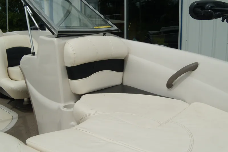 Slide: The Image of 2008 Tahoe Q4 SF boat interior with white and black seating, windshield, and handle. - 5