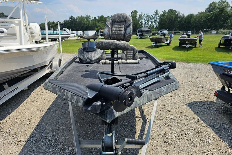 Slide: The Image of 2020 Ranger RT178 fishing boat on display, featuring camouflage design and trolling motor. - 4
