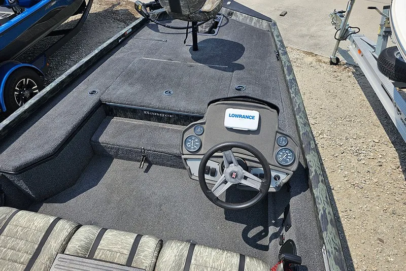 Slide: The Image of 2020 Ranger RT178 boat interior with steering wheel and Lowrance navigation system. - 14