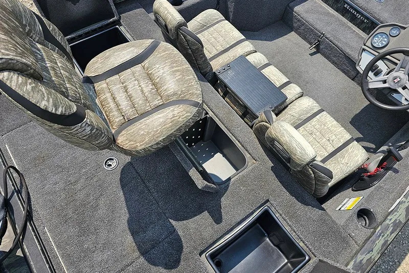 Slide: The Image of 2020 Ranger RT178 boat interior with camo seats and storage compartments. - 10