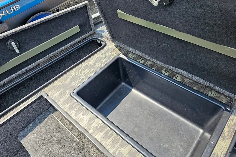 Slide: The Image of 2020 Ranger RT178 boat storage compartment with open lid, showcasing interior space. - 16