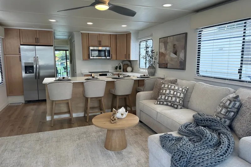 Slide: The Image of Modern interior of a 1993 Sumerset 14x65 houseboat with stylish kitchen and cozy living area. - 3