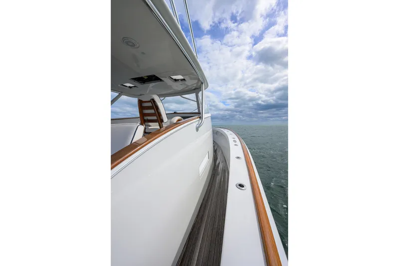 Slide: The Image of 2014 Release Boatworks 46 yacht on open sea under cloudy sky. - 17
