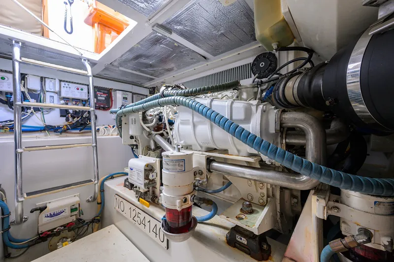 Slide: The Image of Engine room of a 2014 Release Boatworks 46, showcasing machinery and equipment. - 58
