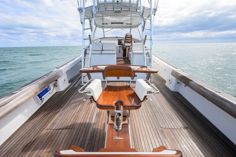 Slide: The Image of 2014 Release Boatworks 46 yacht with wooden deck, ocean view, and fishing chair. - 21