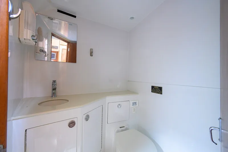 Slide: The Image of Modern bathroom interior on 2014 Release Boatworks 46 yacht, featuring sink and toilet. - 53