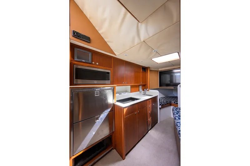 Slide: The Image of Luxurious interior of 2014 Release Boatworks 46, featuring modern kitchen and cozy seating area. - 43
