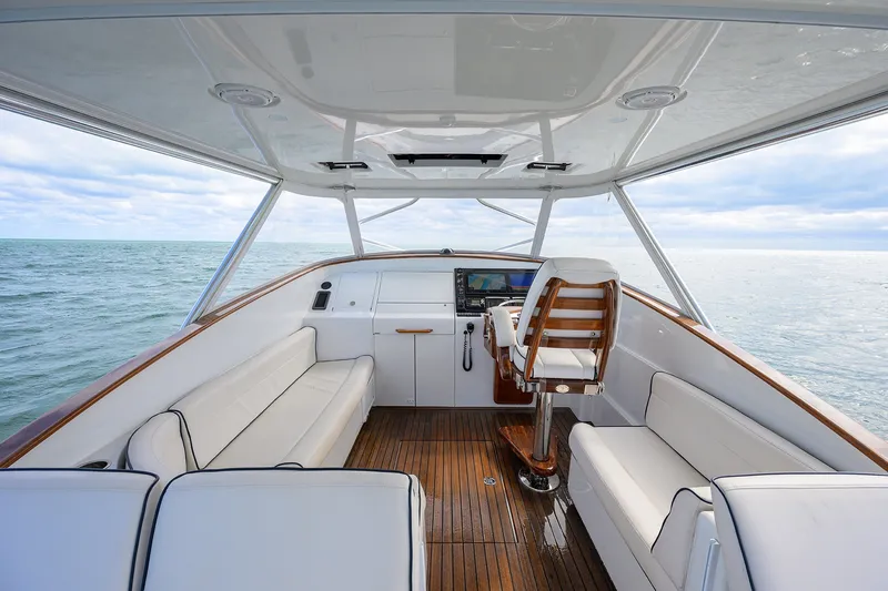 Slide: The Image of Luxurious 2014 Release Boatworks 46 yacht interior with white seating and wooden accents. - 29