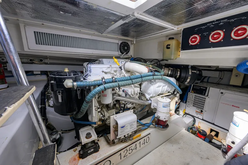 Slide: The Image of Engine room of a 2014 Release Boatworks 46, featuring Cummins Onan generator. - 55