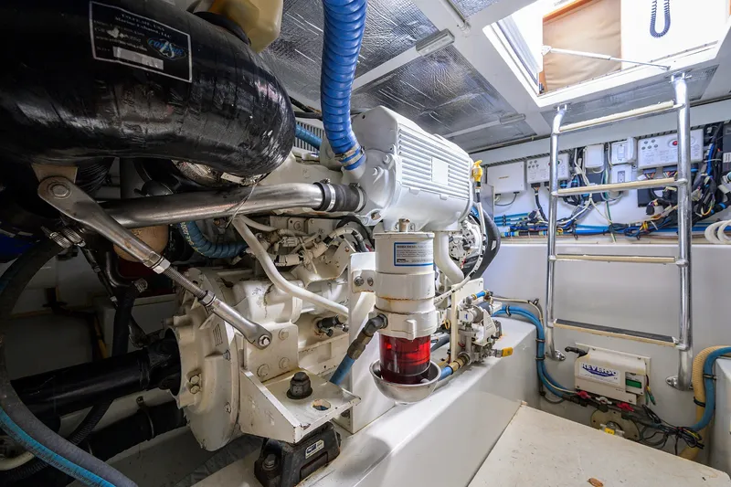 Slide: The Image of Engine room of 2014 Release Boatworks 46, showcasing mechanical components and ladder access. - 59