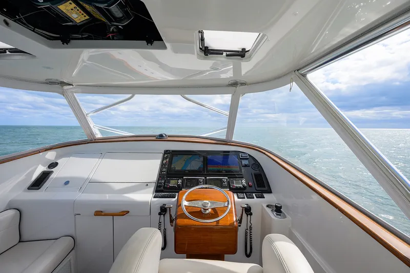 Slide: The Image of Helm of 2014 Release Boatworks 46 yacht with ocean view and navigation equipment. - 36