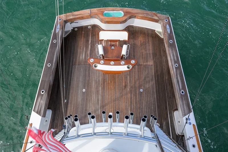 Slide: The Image of Aerial view of 2014 Release Boatworks 46 deck with wooden finish and fishing rod holders. - 18