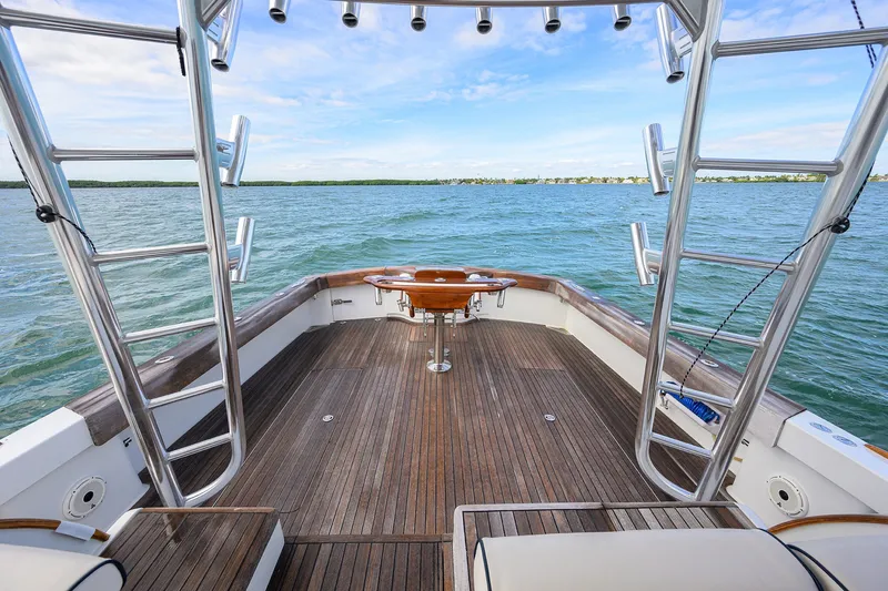 Slide: The Image of Spacious deck of 2014 Release Boatworks 46, featuring wooden flooring and ocean view. - 25