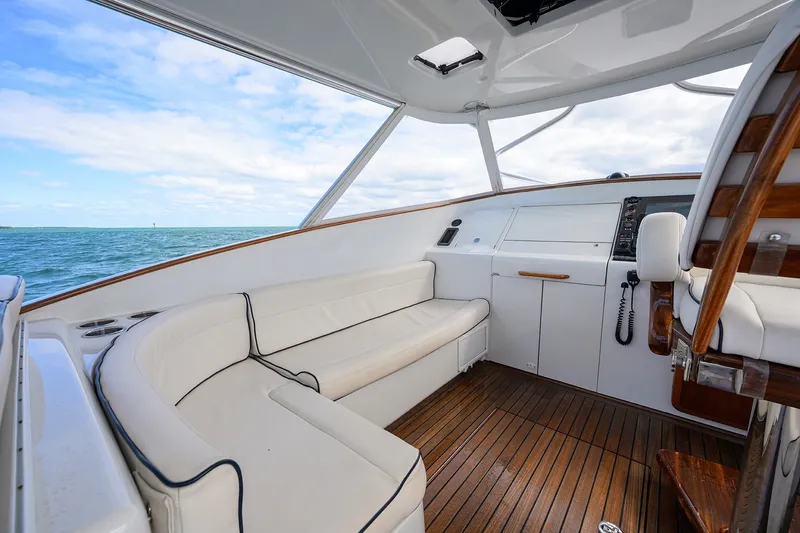Slide: The Image of Luxurious interior of 2014 Release Boatworks 46 yacht with white seating and wooden flooring. - 30