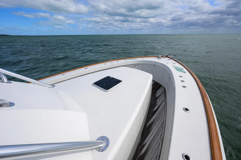 Slide: The Image of Bow view of 2014 Release Boatworks 46 yacht on open water under cloudy sky. - 11