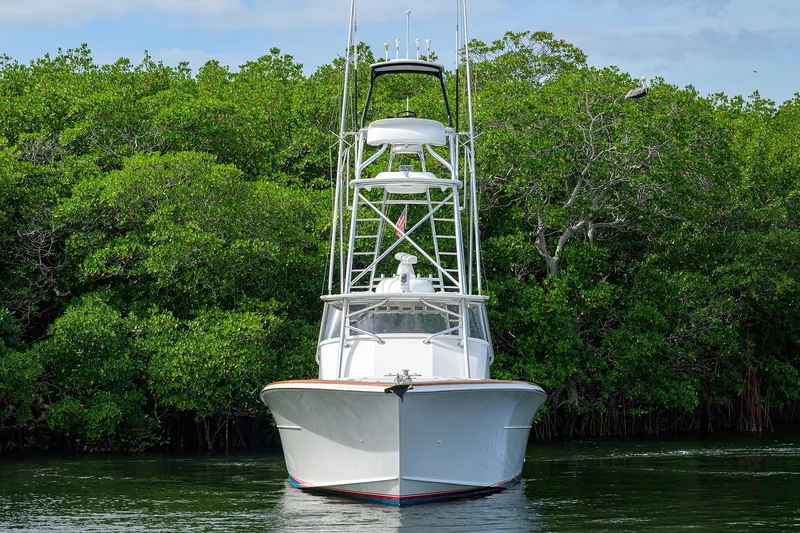 Slide: The Image of Front view of 2014 Release Boatworks 46 yacht against lush green mangroves. - 4