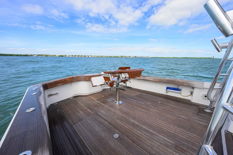 Slide: The Image of Deck view of 2014 Release Boatworks 46 on open water under blue sky. - 24