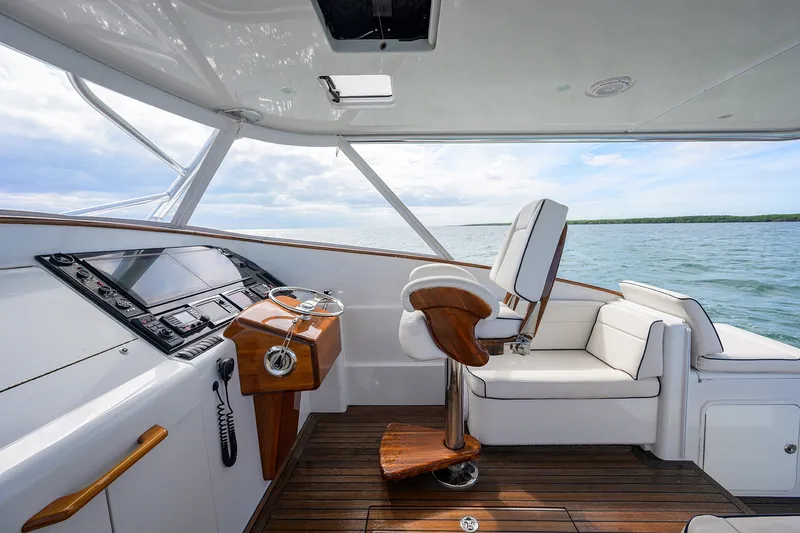 Slide: The Image of Luxurious helm of 2014 Release Boatworks 46, featuring elegant wood accents and modern controls. - 33