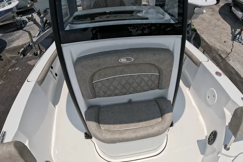 Slide: The Image of 2026 Seahunt BX25FS boat interior with cushioned seating and sleek design. - 10