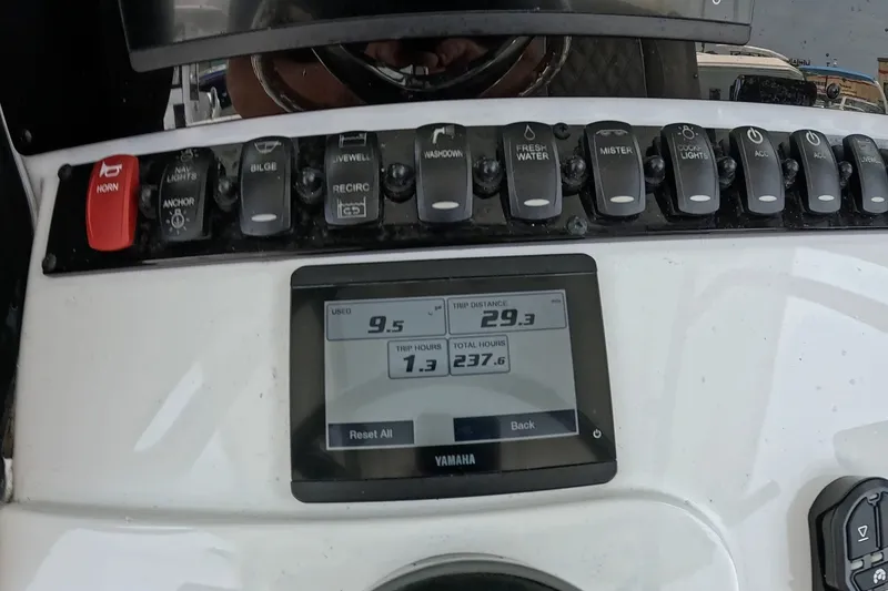 Slide: The Image of Control panel of 2026 Seahunt BX25FS boat with Yamaha display and switches. - 9