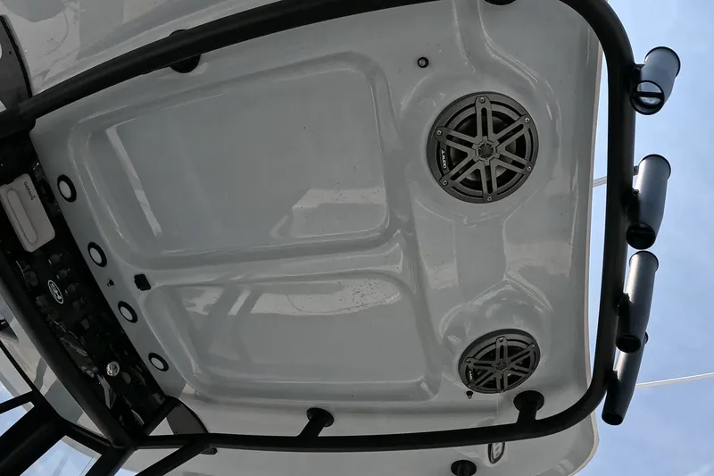 Slide: The Image of 2026 Seahunt BX25FS boat roof with speakers and rod holders. - 17