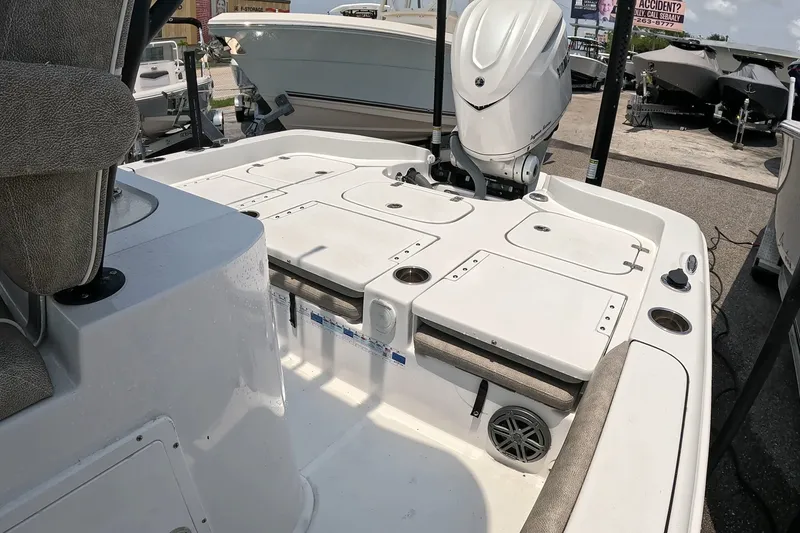 Slide: The Image of 2026 Seahunt BX25FS boat interior with seating and storage compartments. - 22