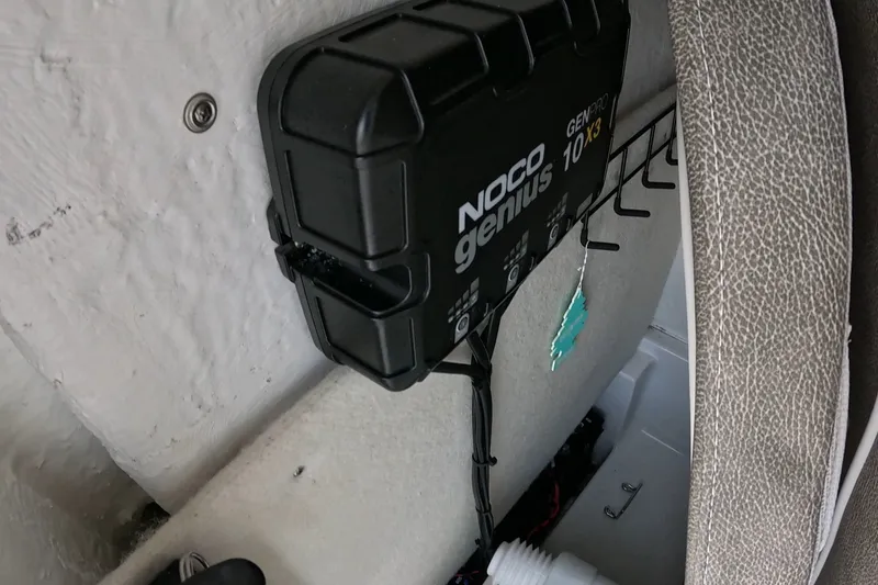 Slide: The Image of NOCO Genius GenPro 10X3 charger installed on 2026 Seahunt BX25FS boat interior. - 13