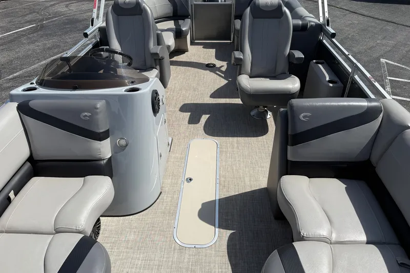 Slide: The Image of 2019 Crestliner 200 Rally DX CWDH pontoon boat interior with gray seating and helm. - 18