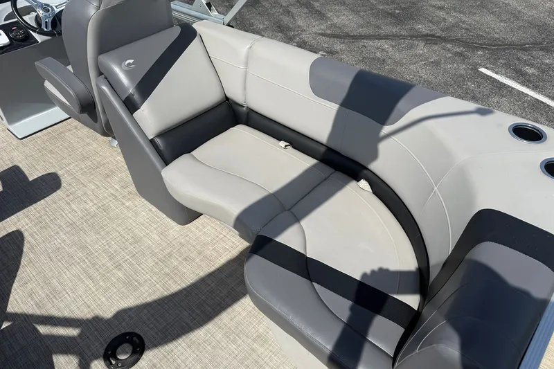 Slide: The Image of 2019 Crestliner 200 Rally DX CWDH boat interior with gray seating and cup holders. - 6