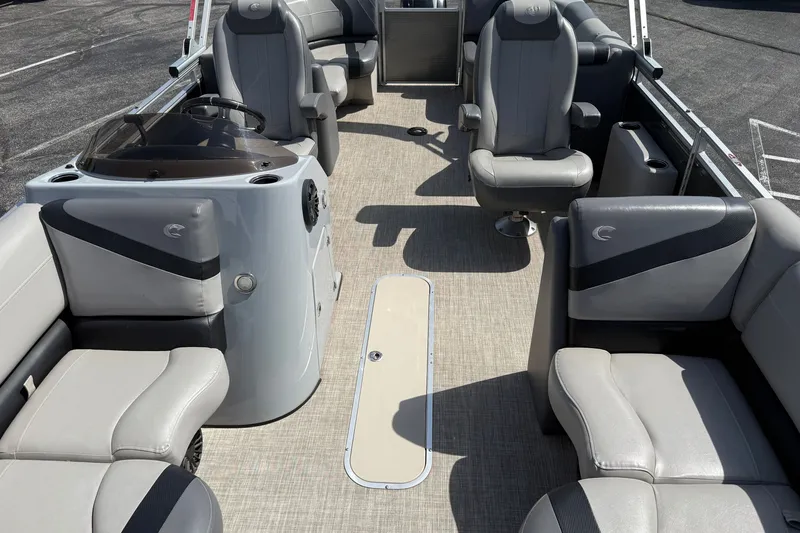 Slide: The Image of 2019 Crestliner 200 Rally DX CWDH pontoon boat interior with gray seating and helm. - 17