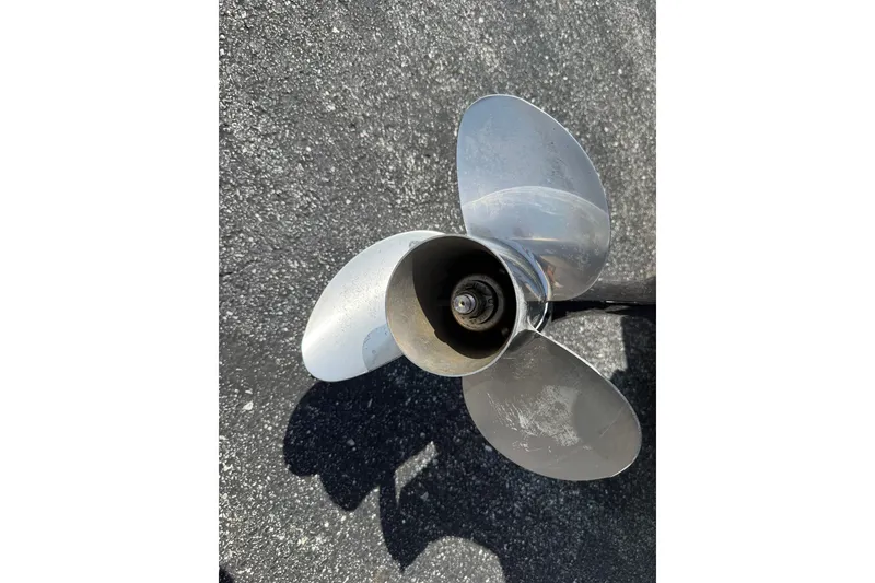 Slide: The Image of Propeller of 2019 Crestliner 200 Rally DX CWDH boat on asphalt surface. - 19