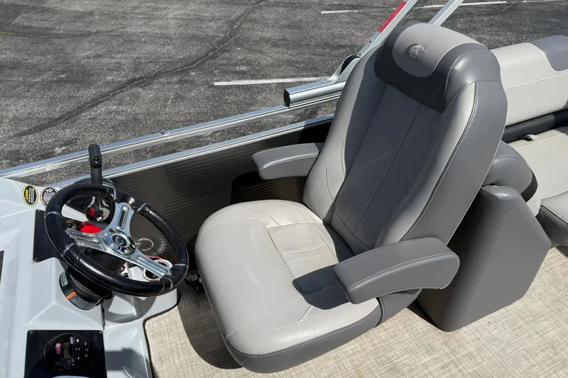 Slide: The Image of 2019 Crestliner 200 Rally DX CWDH boat interior with steering wheel and captain's chair. - 12