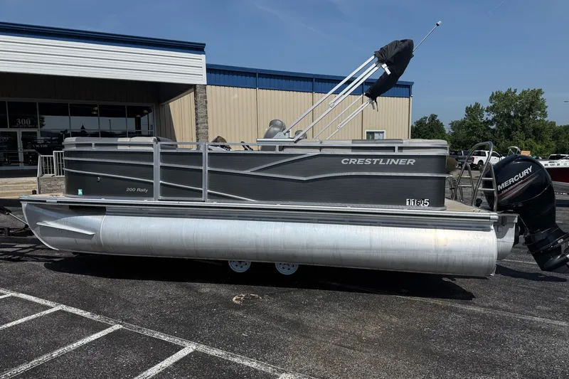 Slide: The Image of 2019 Crestliner 200 Rally DX CWDH pontoon boat with Mercury outboard motor, parked outdoors. - 4