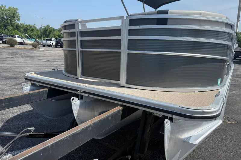 Slide: The Image of 2019 Crestliner 200 Rally DX CWDH pontoon boat on trailer in parking lot. - 23