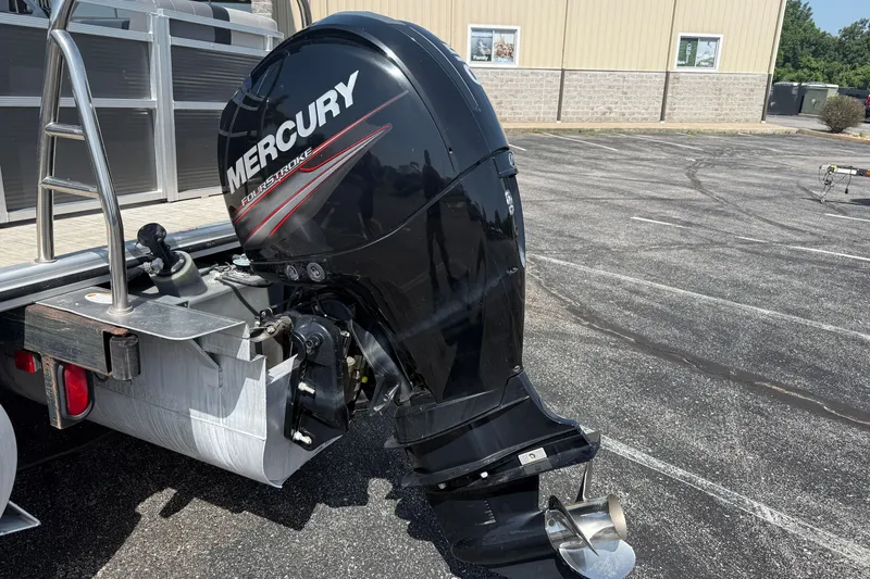 Slide: The Image of 2019 Crestliner 200 Rally DX CWDH with Mercury outboard motor in parking lot. - 21