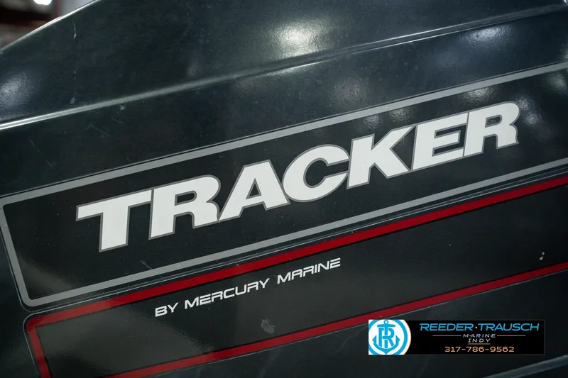 Slide: The Image of 1998 Nitro 700 LX SC boat with Tracker by Mercury Marine branding. - 48