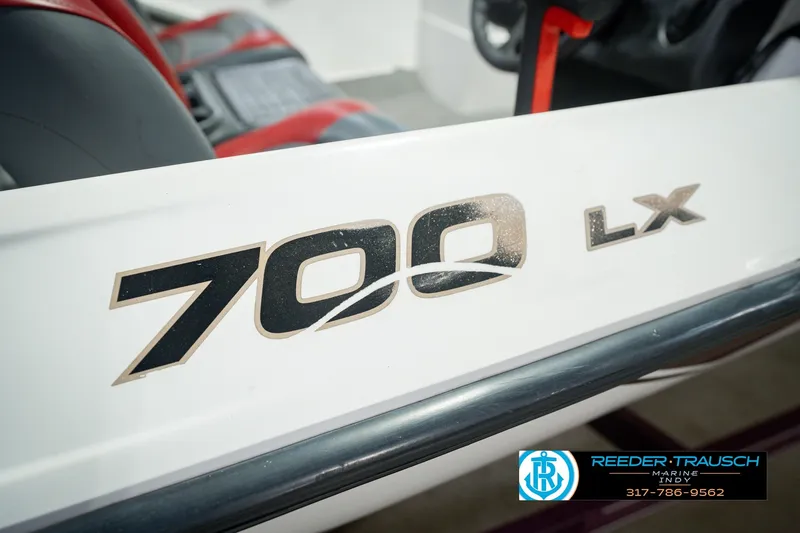 Slide: The Image of 1998 Nitro 700 LX SC boat interior with logo and seating detail. - 57