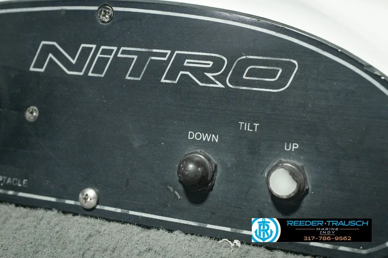 Slide: The Image of Control panel of a 1998 Nitro 700 LX SC boat with tilt adjustment buttons. - 45