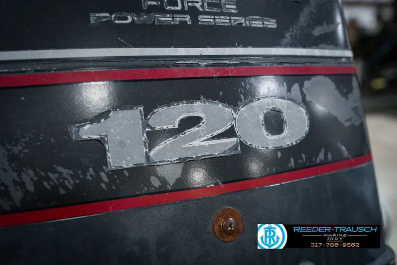 Slide: The Image of Close-up of a weathered "120" decal on a 1998 Nitro 700 LX SC boat. - 49
