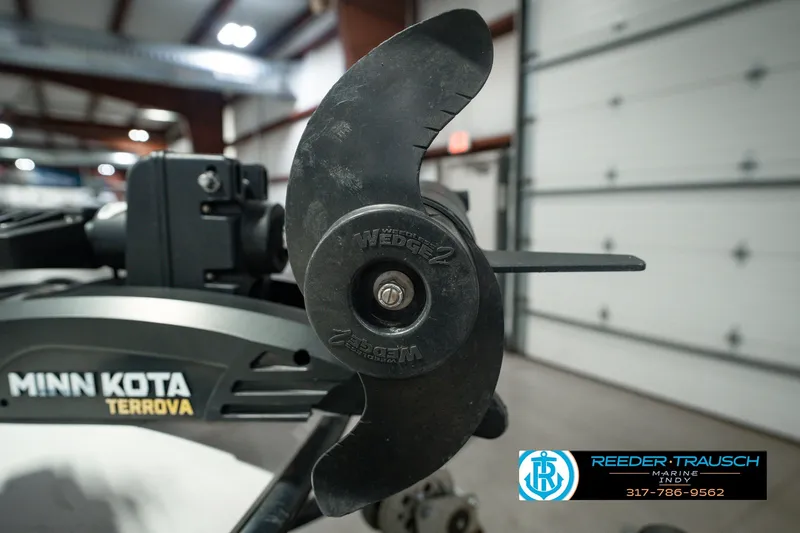 Slide: The Image of Minn Kota Terrova motor on 1998 Nitro 700 LX SC boat in a garage setting. - 55